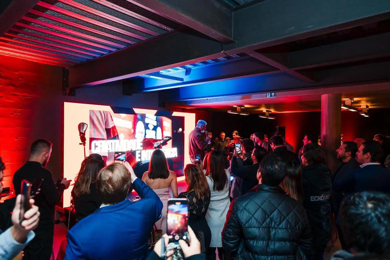 Guests filming the LED panel on their phones as a loop runs